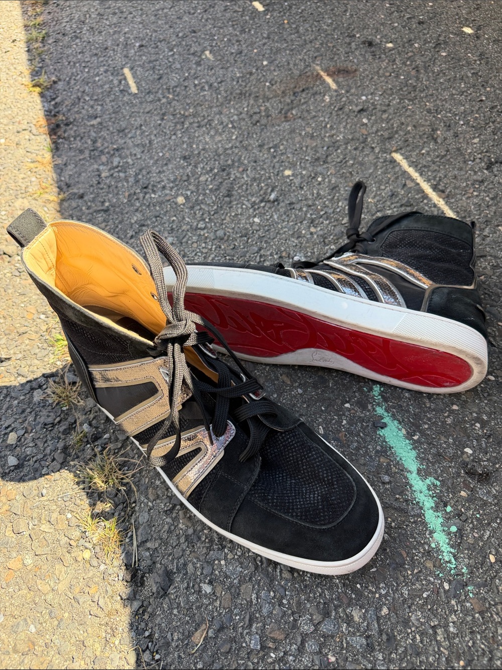 Christian Louboutin Black High-Top Sneakers with Red Soles and Metallic Straps